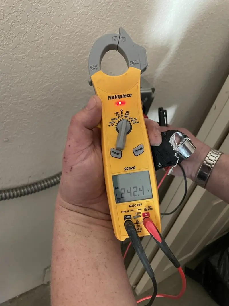 Voltage testing with clamp meter during Ceiling Fan Installation in Westwood